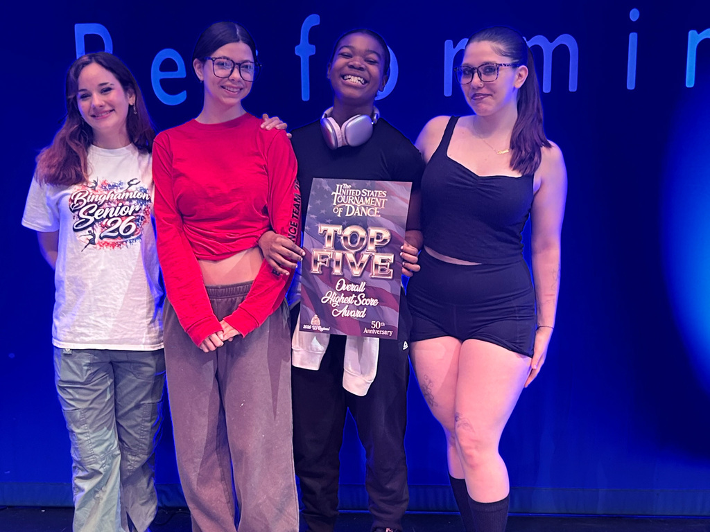 bhs dance students hold top 5 high score banner