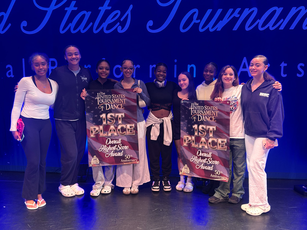 bhs dance students holding first place banners
