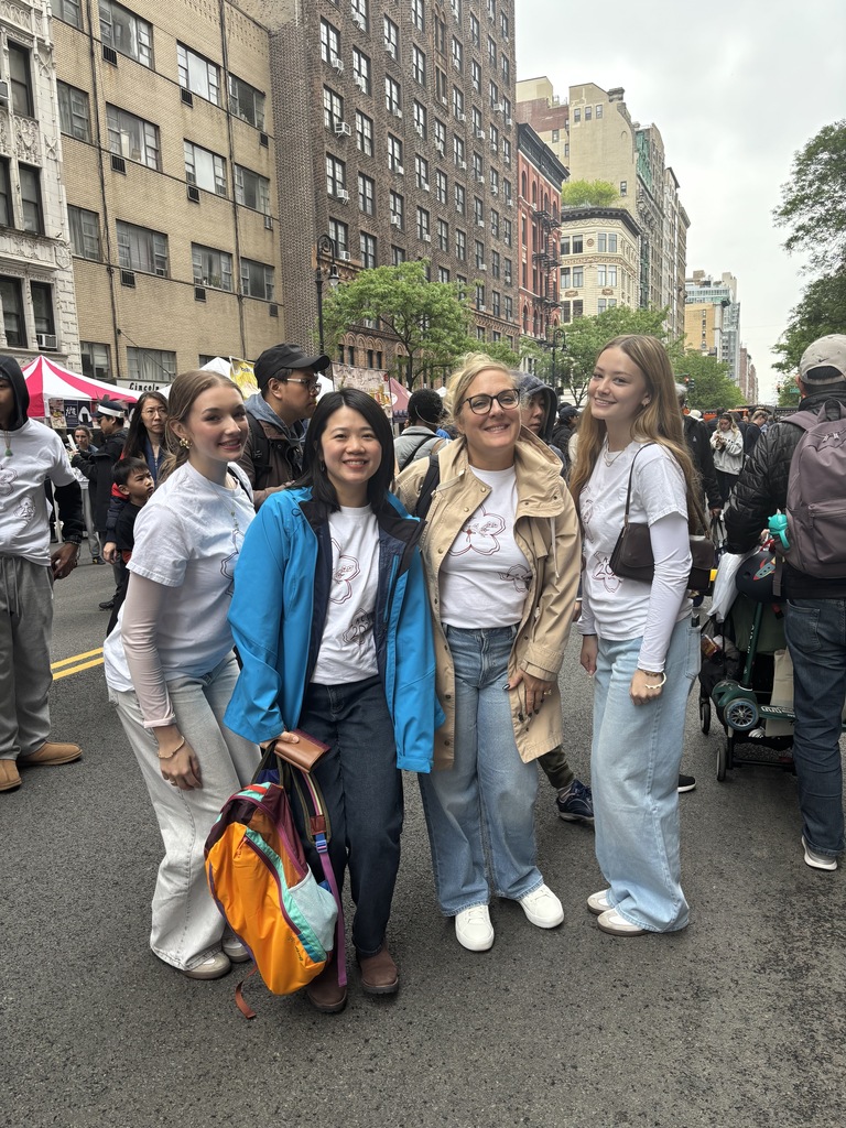 students and teachers pose for photo during asian cultural club trip to NYC