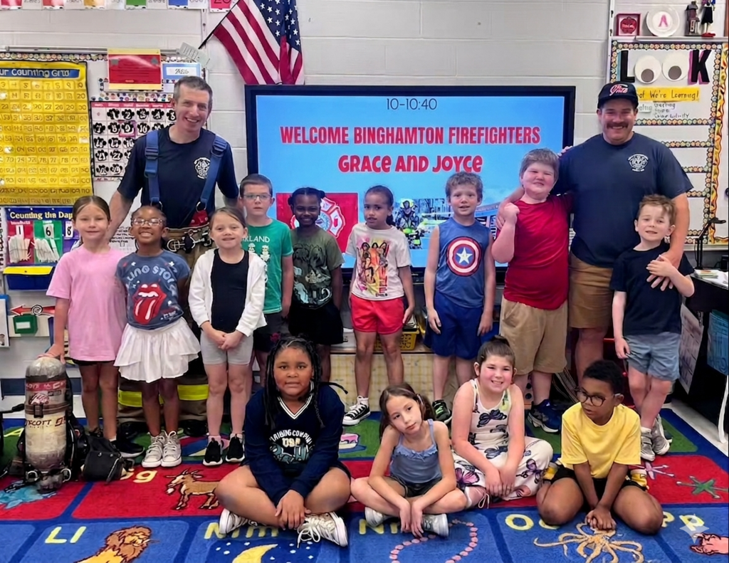 thomas jefferson students pose for photo with binghamton firefighters