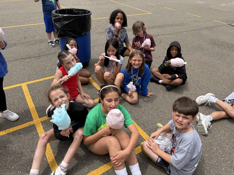 students eat cotton candy at TJ Fun Day