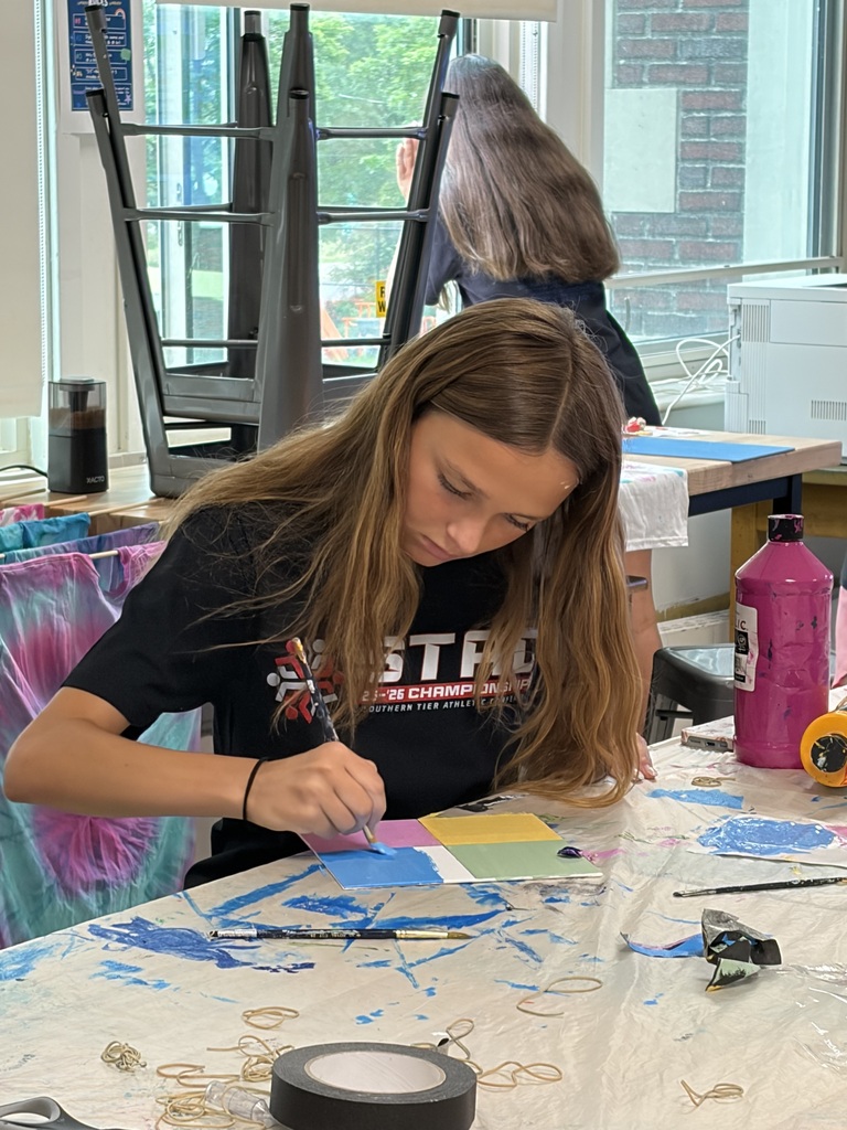 student paints during mixed media camp at BHS