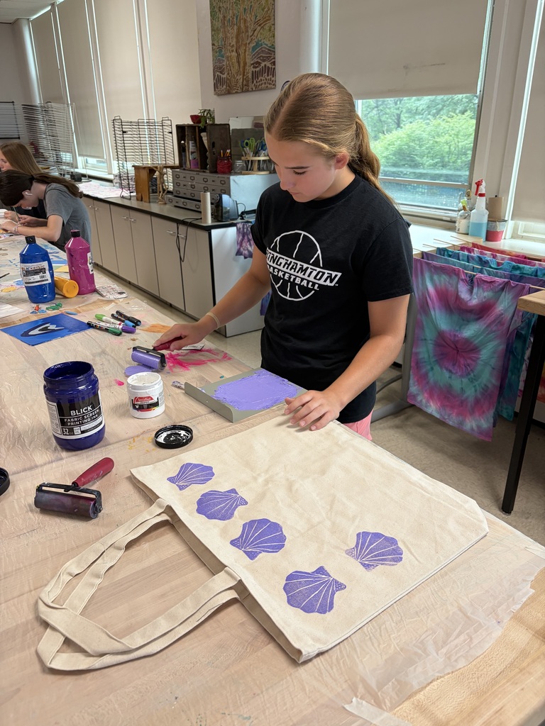 student paints canvas tote bag during mixed media camp at BHS