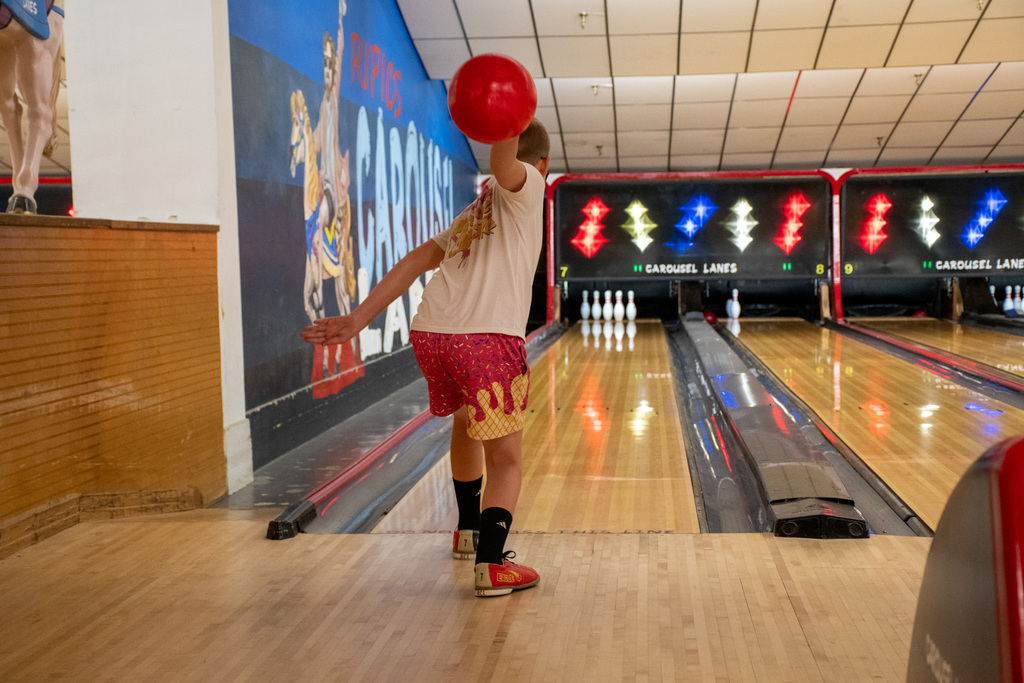 student throws ball during bowling camp