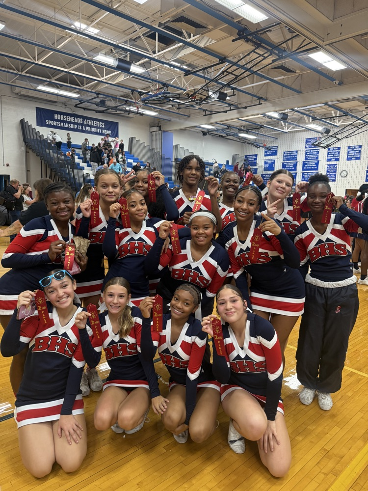 BHS JV cheer team poses for photos holding second place ribbons