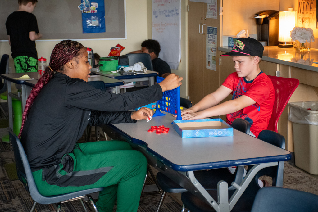 binghamton university women's basketball player plays connect 4 with macarthur student
