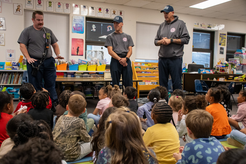 three fire fighters talk to kindergarten students in thomas jefferson classroom