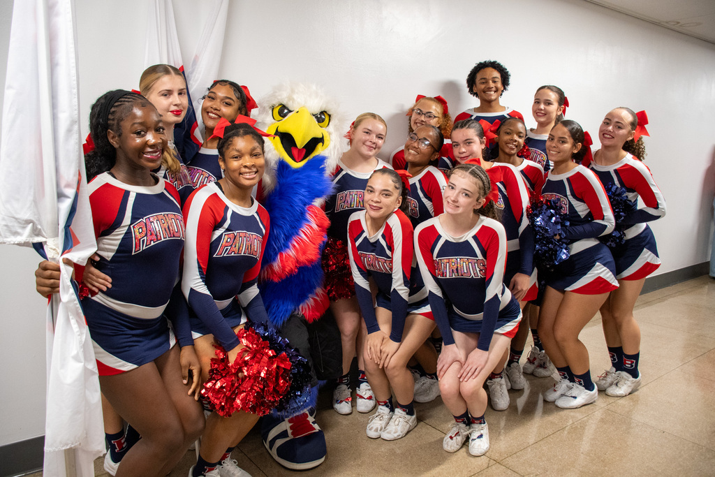 bhs patriotic eagle mascot swoop poses for photo with cheer team