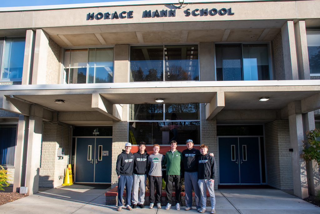 six binghamton university lacrosse players pose for photo outside horace mann