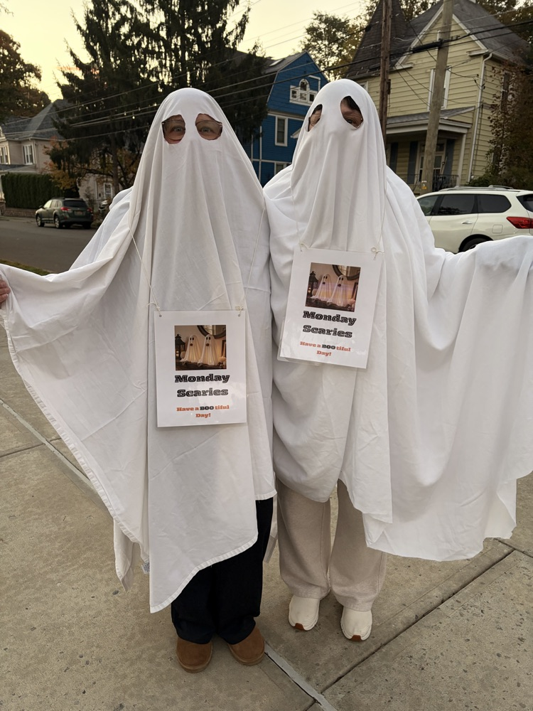 Horace Mann teachers wearing ghost costumes
