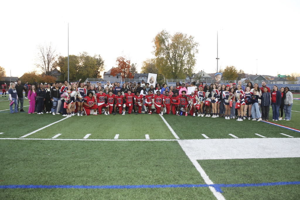 seniors from football and cheer teams with their families