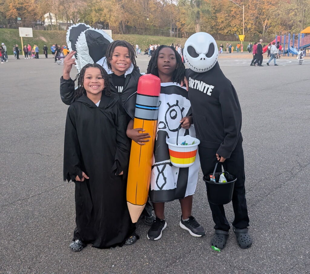 calvin coolidge students in costumes at trunk or treat