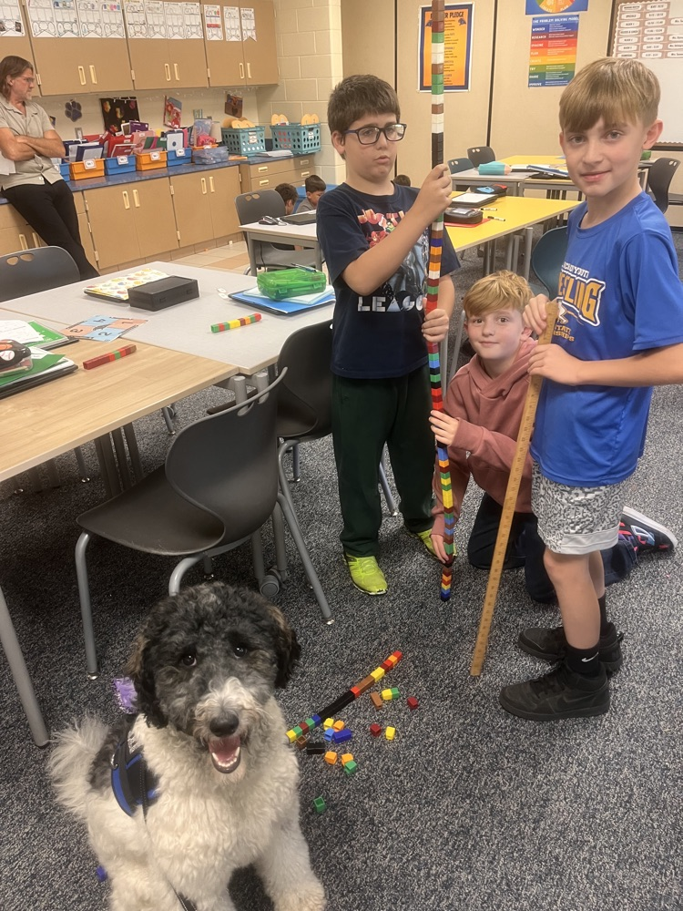 Kids with the therapy dog  