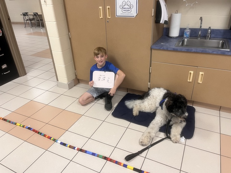 Kids with the therapy dog. 
