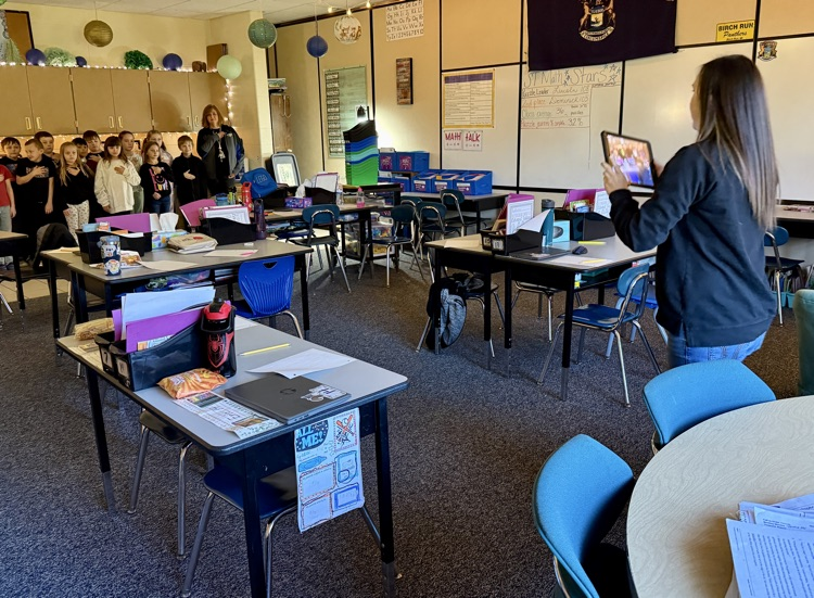 Mrs. Glenn is recording announcements