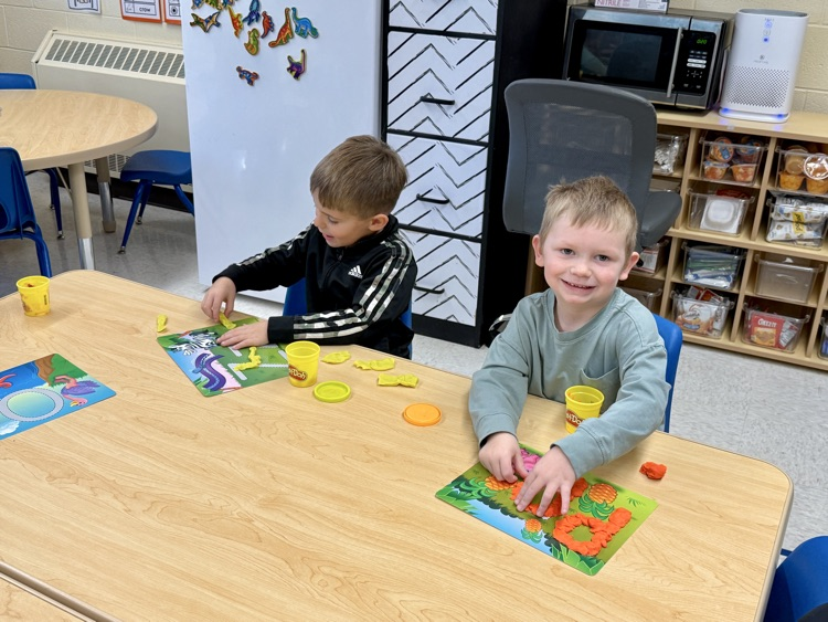 PreK playing with playdough letter mats
