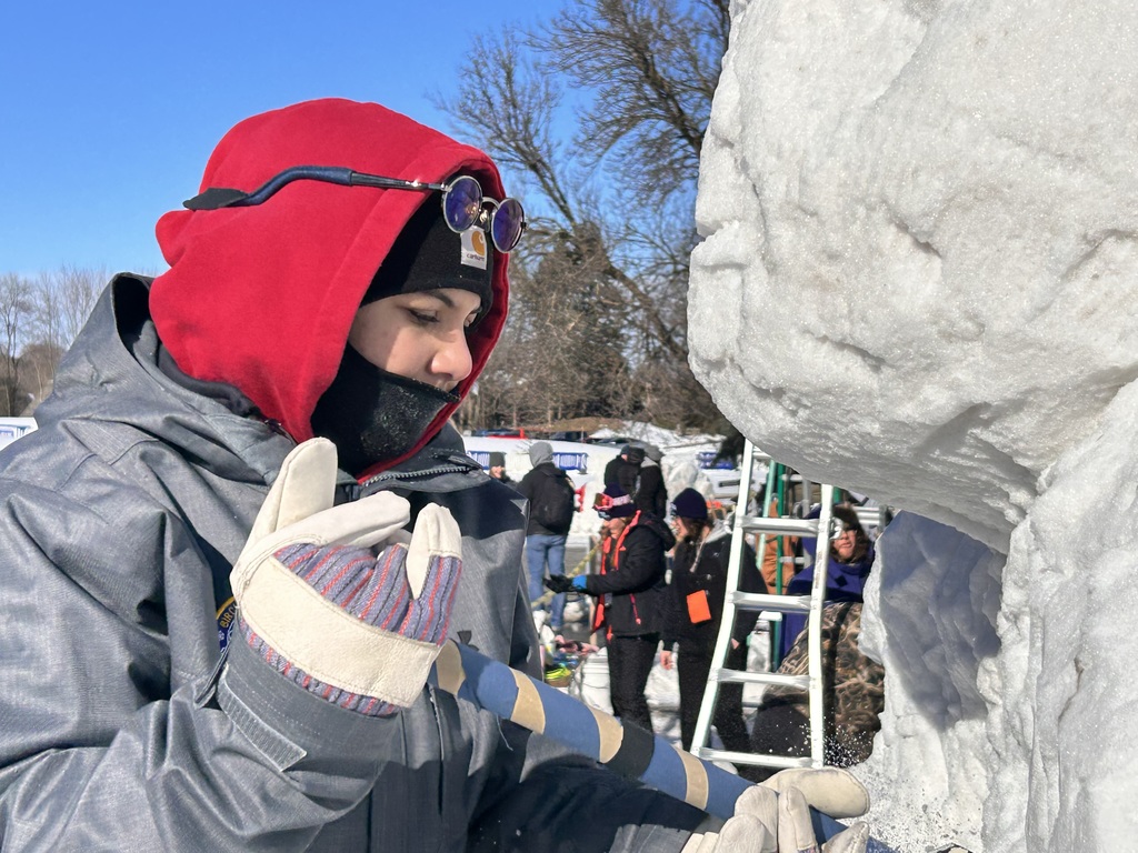 A BRHS sculptor works on the sculpture.