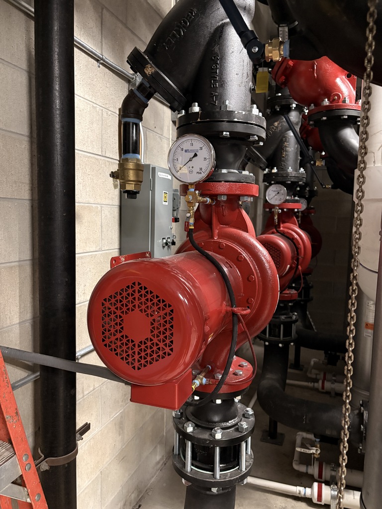 Pumps that will take the heated water from the boiler and around the school are displayed.