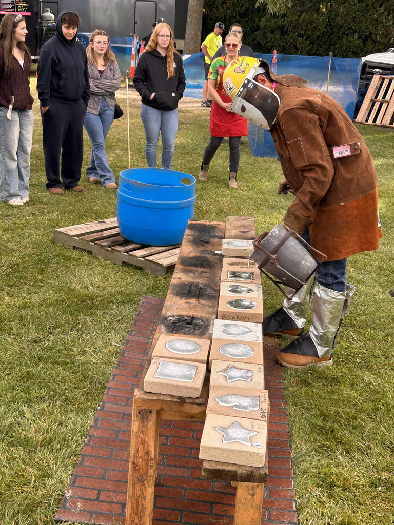 artist pouring sluminum