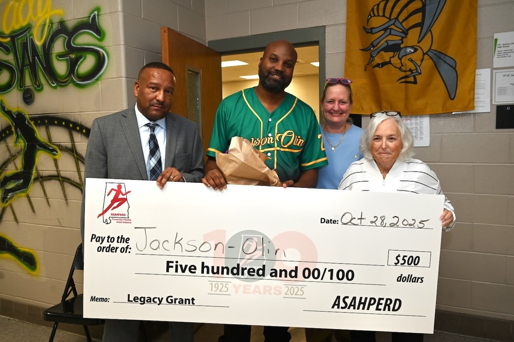 Jackson-Olin Principal Jesse Daniel and Coach Rodney Dorsey, BCS PE Program Specialist Dr. Sherri Huff, and ASAHPERD's Wanda Gilmore