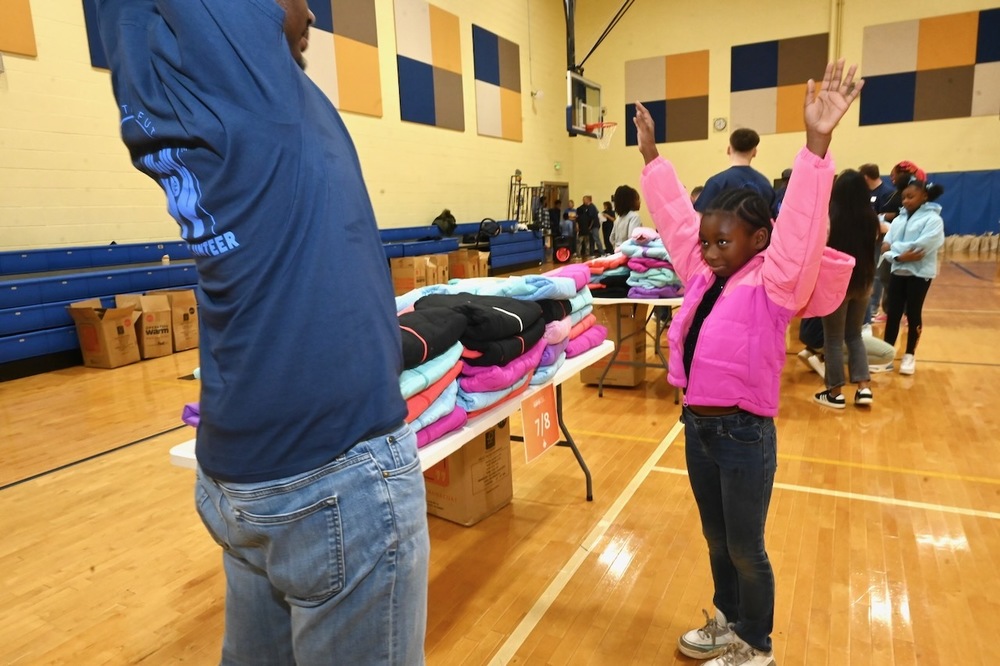 Hemphill student tries on coat
