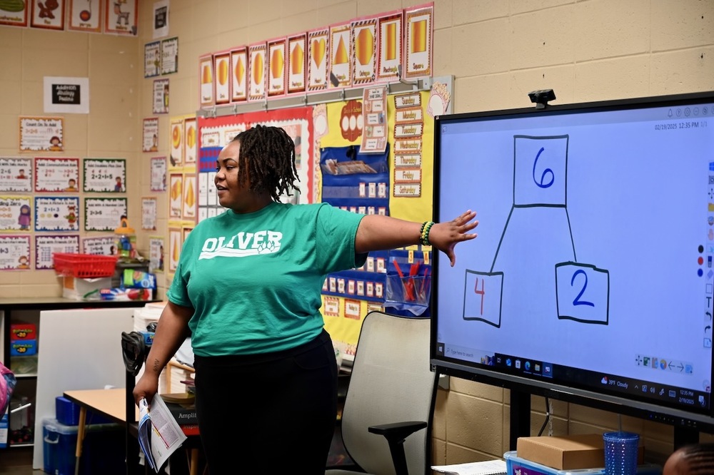 Ashley Gaynor, first grade teacher at Oliver Elementary School, teaches math during an intersession class.