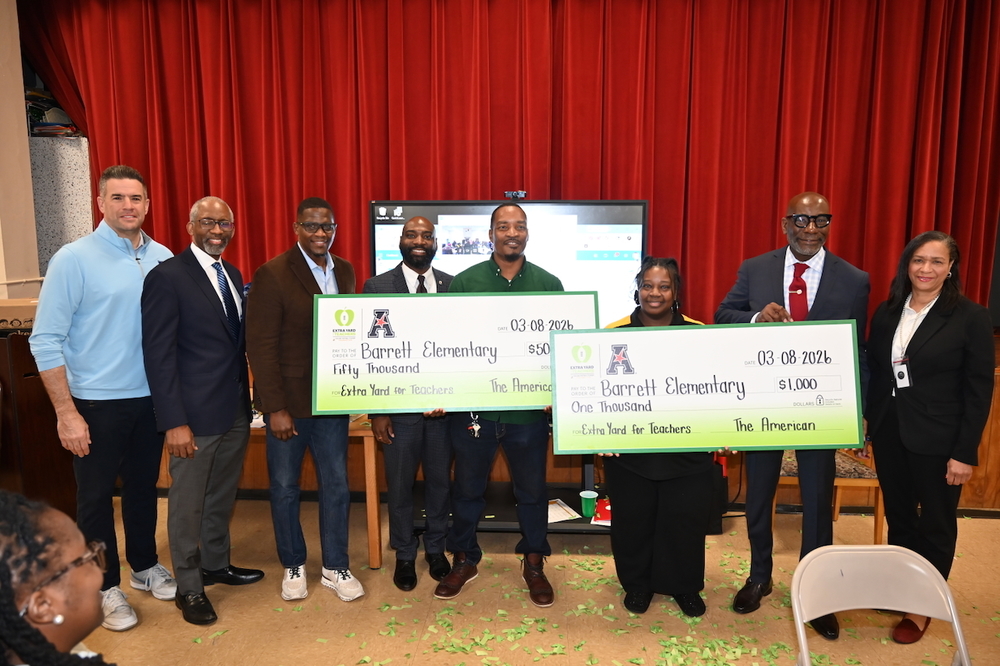 AAC Commissioner Tim Pernetti, Instructional Superintendent Dr. Craig Witherspoon, Board President Sherman Collins and Vice President James Sullivan, Barrett Assistant Principal Byron Archibald and  Teacher of the Year Kiara Lawson-Pierce, Superintendent Dr. Mark Sullivan, and BCS Textbook/Library Media Coordinator Christina Norman