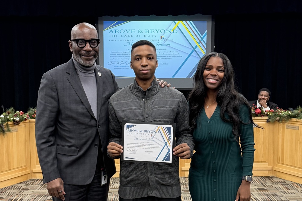 Superintendent Dr. Mark Sullivan, Jackson-Olin's Derrick Johnson, and Board Member Yamika Foy