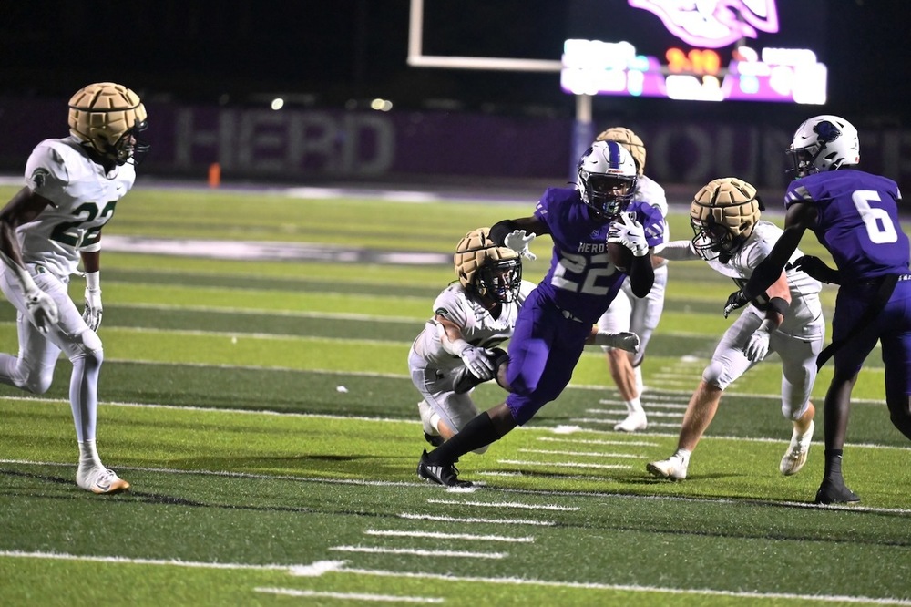 Parker's Chancellor Sparks carries the ball against Mountain Brook.