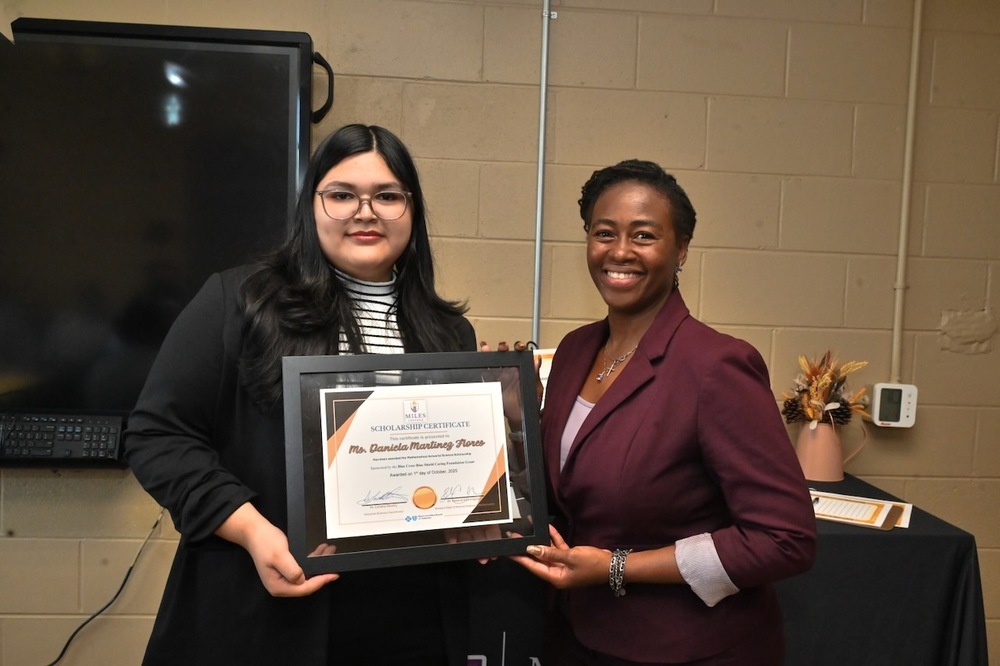 Daniela Martinez Flores receives scholarship certificate from Dr. Loretta Westry, Actuarial Sciences Coordinator at Miles College