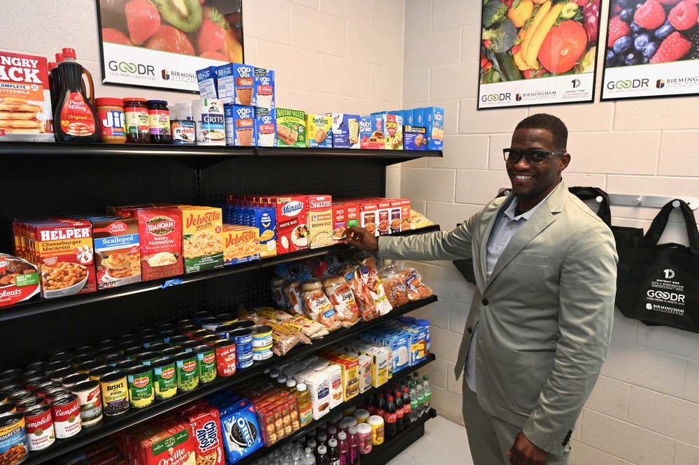 BBOE Member Sherman Collins browses the Goodr Grocery Store at Huffman Middle School