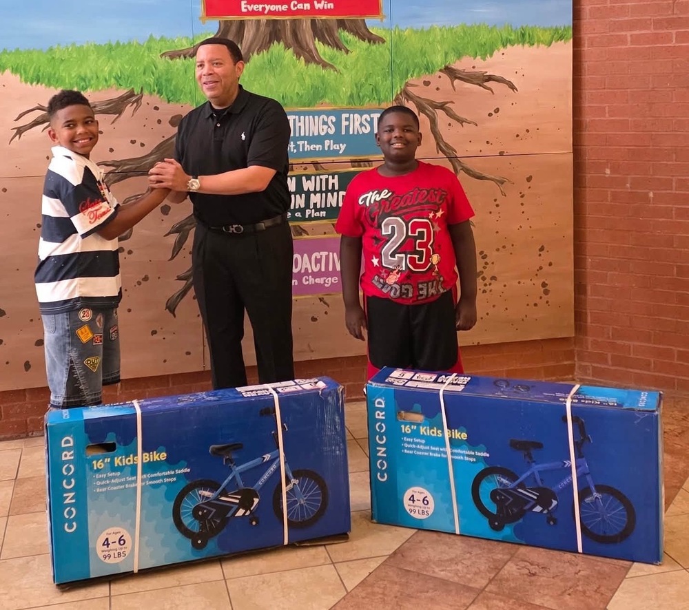 Jefferson County District Attorney Danny Carr and the winners from Tuggle!
