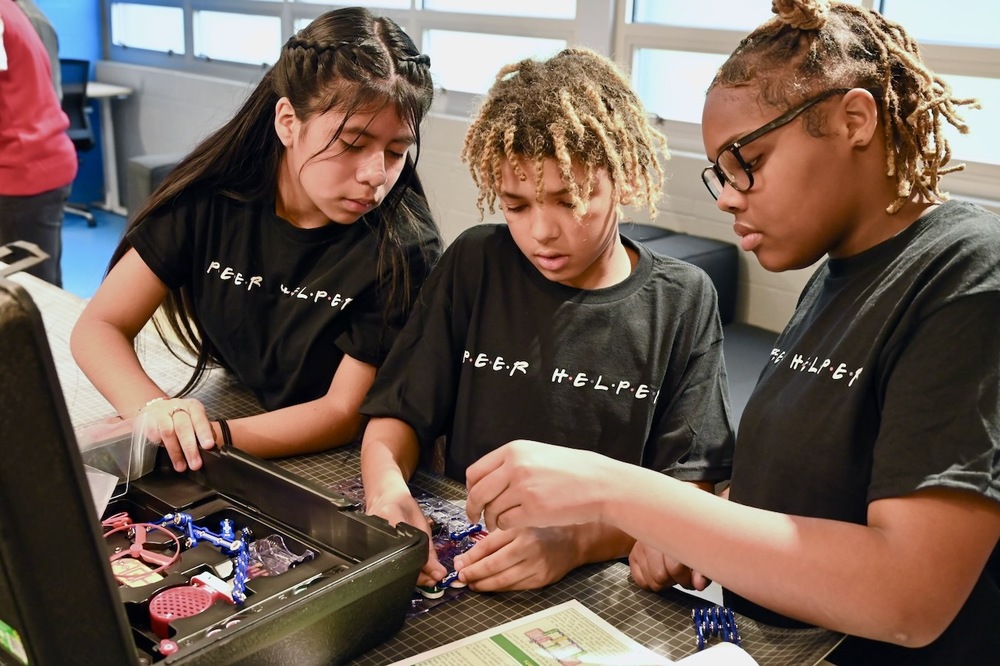 Peer Helpers from Smith Middle operate a Snap Circuit module.