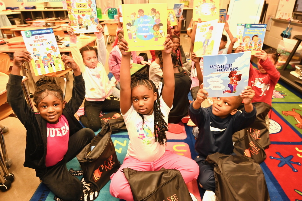 Scholars at Huffman Academy receive new books to read!