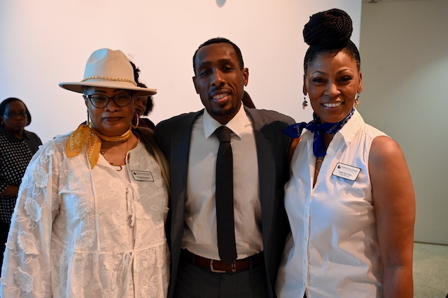 Board President Jason Meadows (center) poses with Sherrell Cheatom and Della Nicholas from HR.