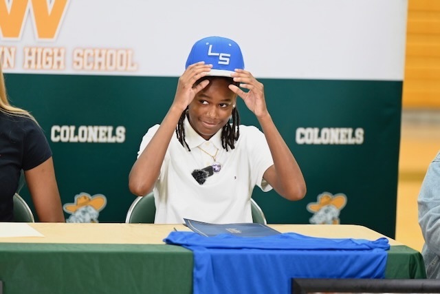 Ashley Smedley puts on the Lawson State cap