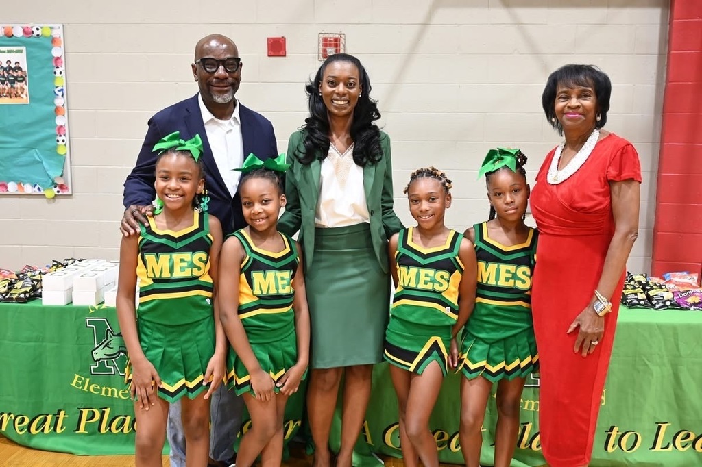 Superintendent Dr. Mark Sullivan, Minor Elementary Principal Dr. Raynetta Wiggins, and Learning Network 1 Instructional Superintendent Dr. Gwendolyn Tilghman with the Minor Cheer Squad