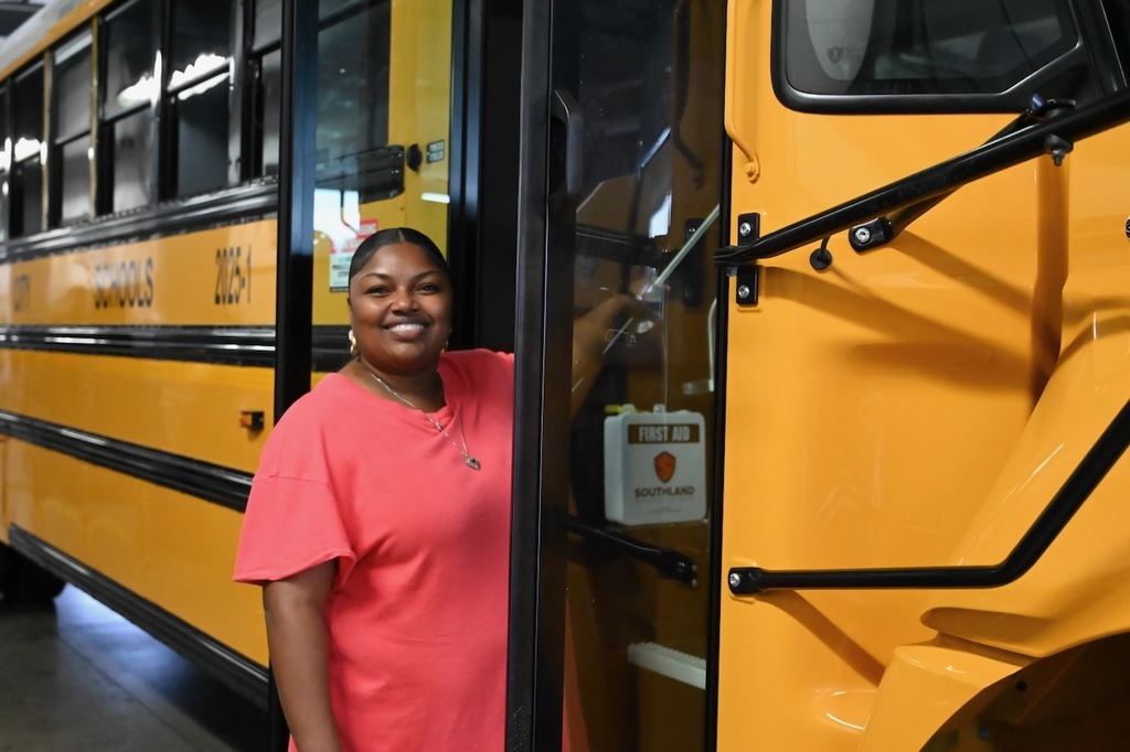 Bus driver Carmen Jackson prepares to step aboard one of our new buses.