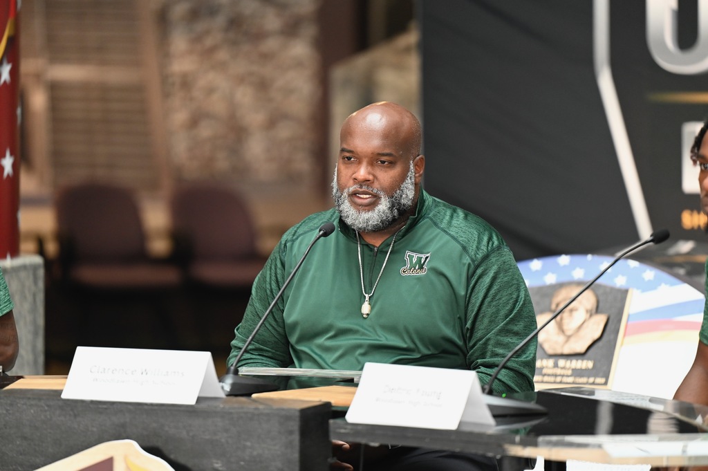 Coach Clarence Williams answers a question.