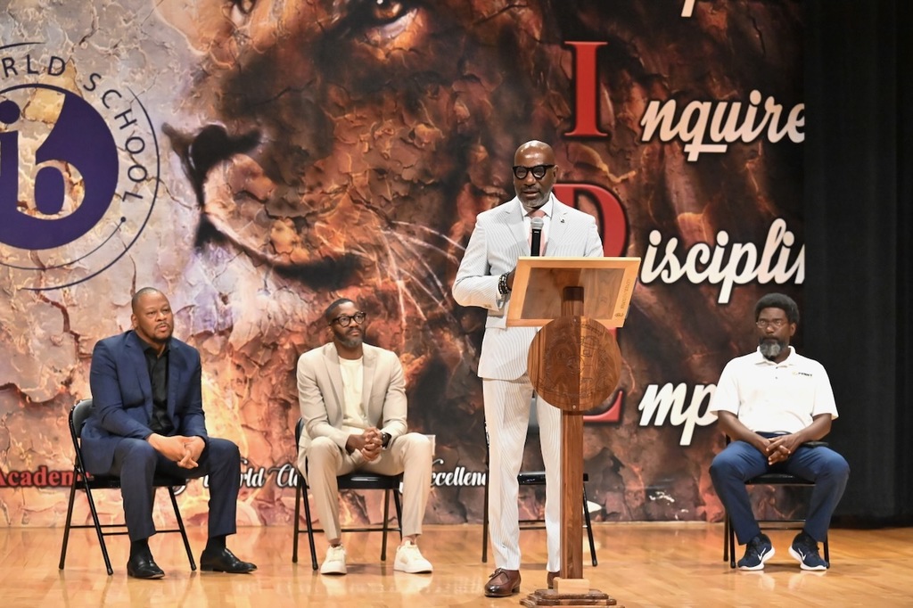 Dr. Mark Sullivan speaks as HABD's Larry Williams, Mayor Randall Woodfin, and Lyord Watson of Penny Foundation look on
