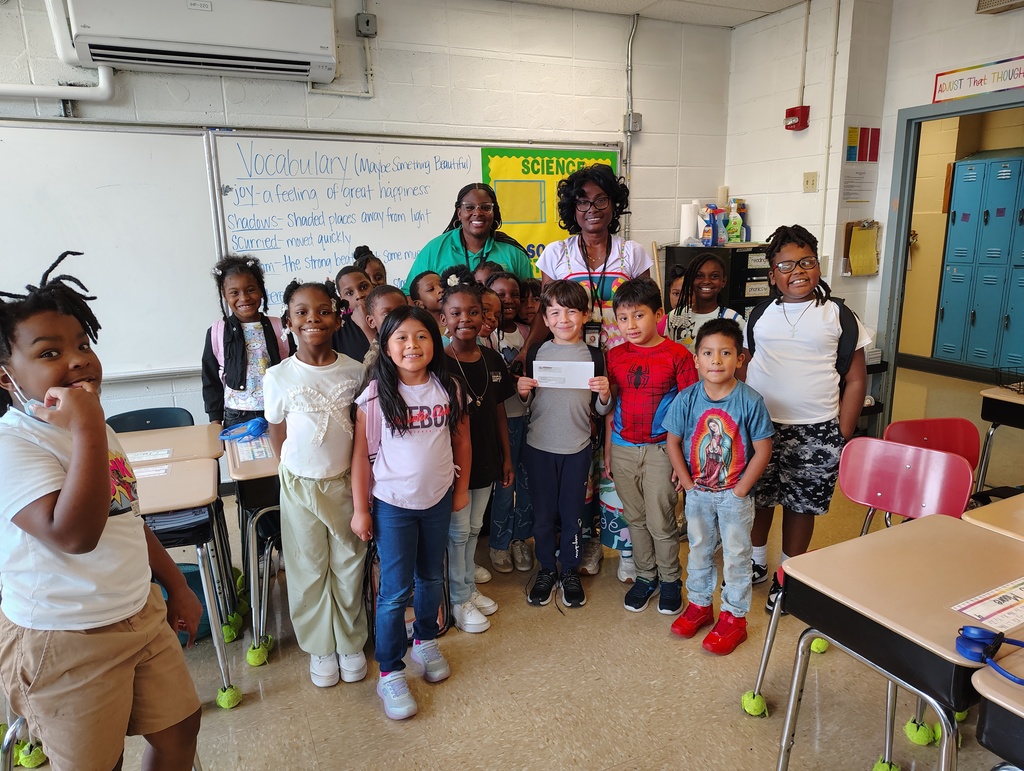 Mrs. Avery's 2nd grade class standing around Mrs. Lawson