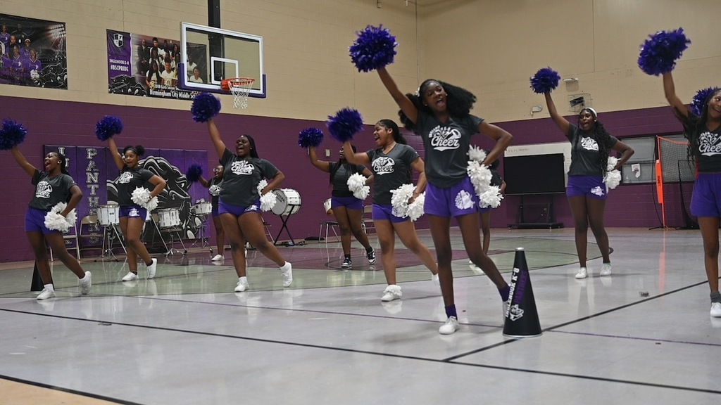 the cheer squad gets the student body hyped up!