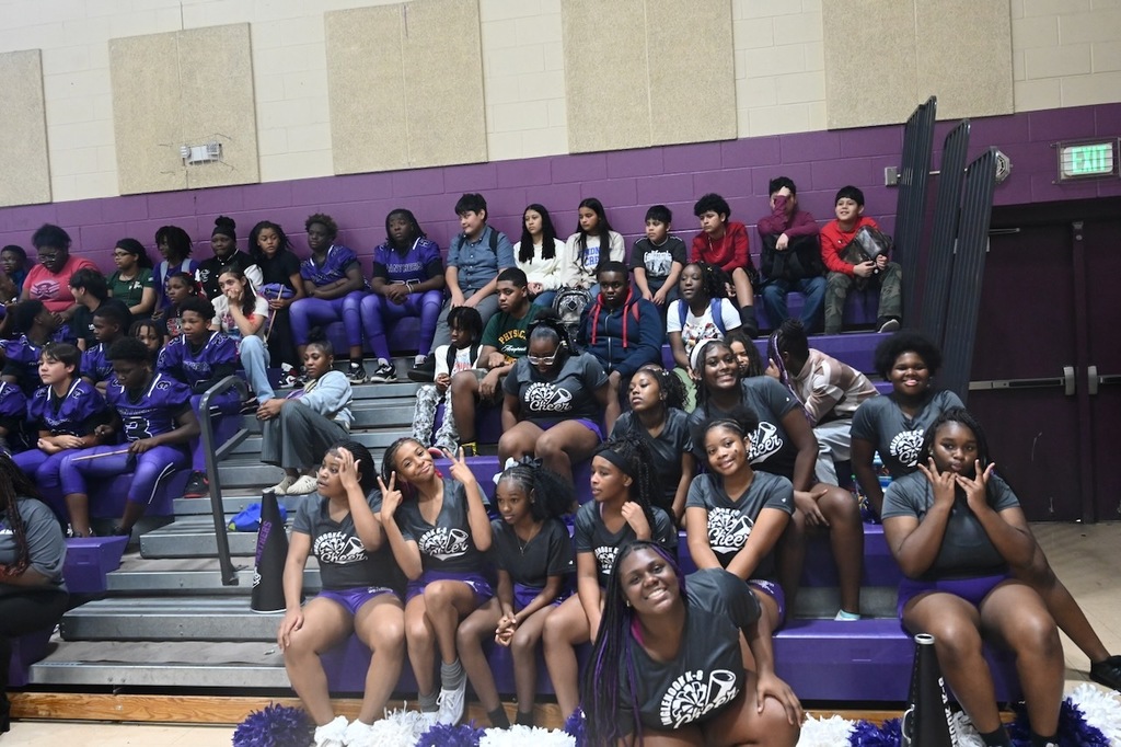 The cheer squad poses for a photo