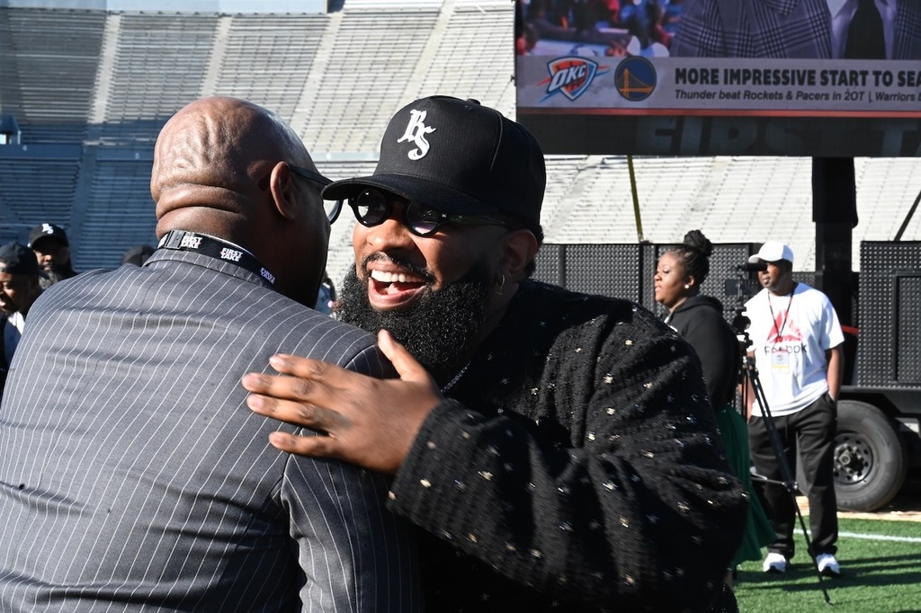Pastor Mike Jr. greets a friend