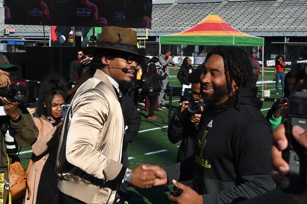 Football star Cam Newton catches up with Jackson-Olin Coach Joe Webb