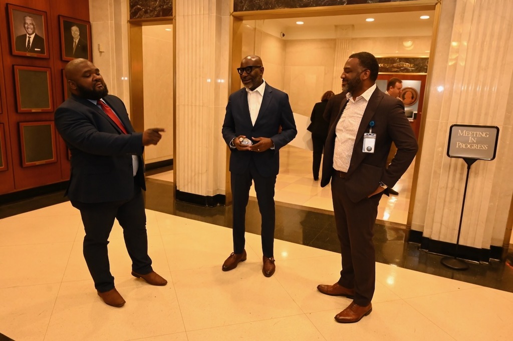 Board member Antone Womack chats with Superintendent Dr. Mark Sullivan and Chief of Staff Dr. Terry Lamar
