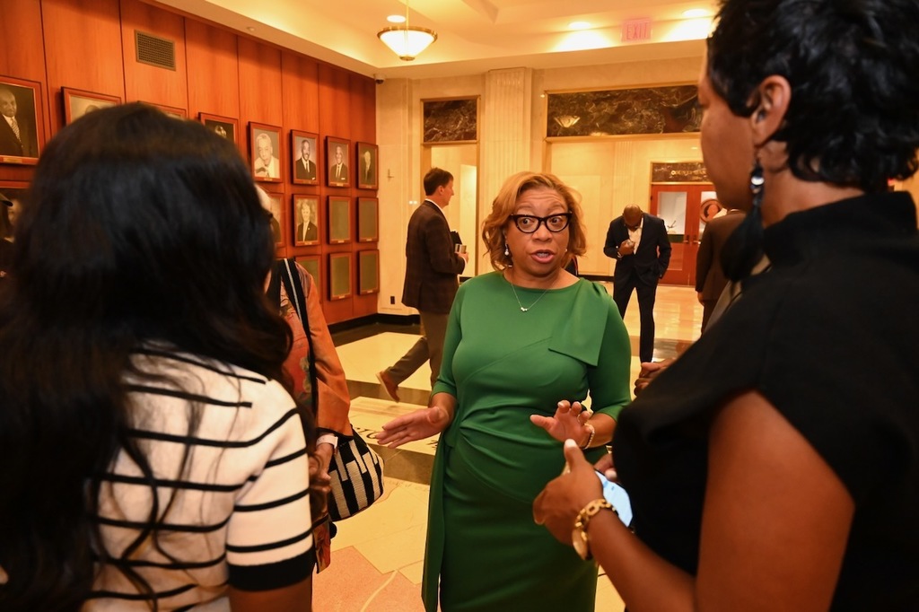 Lashunda Scales speaks with board members.