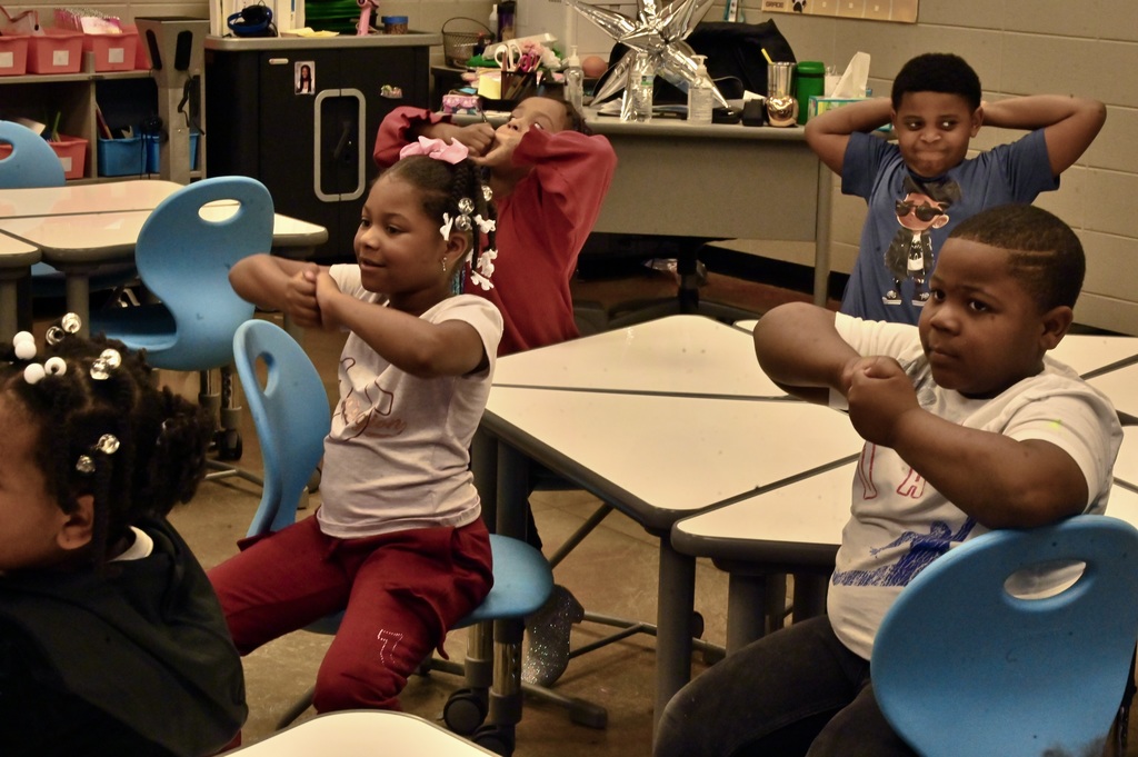 Stretching exercises during STEAM Day at Oxmoor Valley