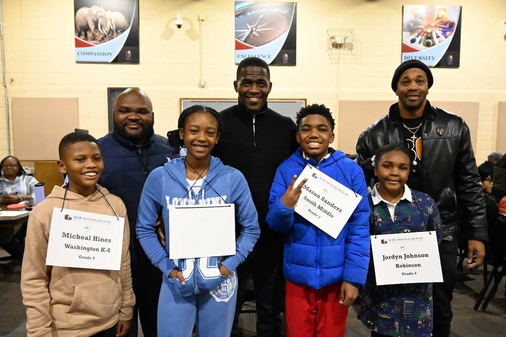 Board Member Antwon Womack and Board President Sherman Collins pose with scholars