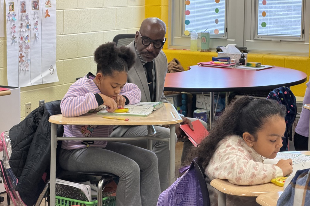 Superintendent Dr. Mark Sullivan observes a student at Tuggle